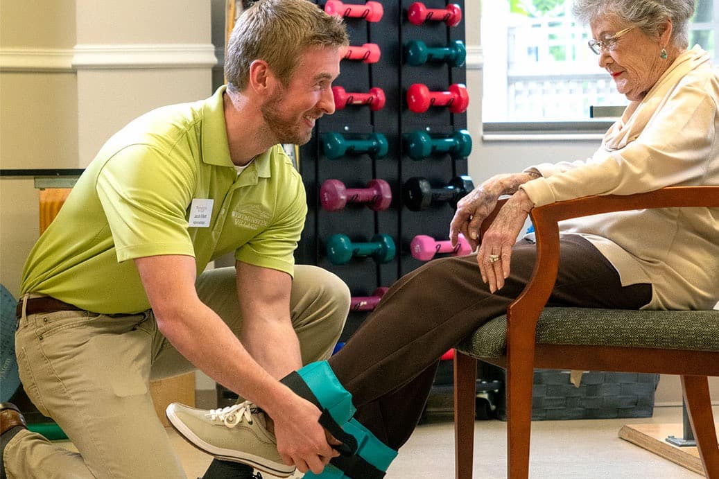 A team member provides physical therapy for a resident at Westminster Village in Terre Haute, Indiana