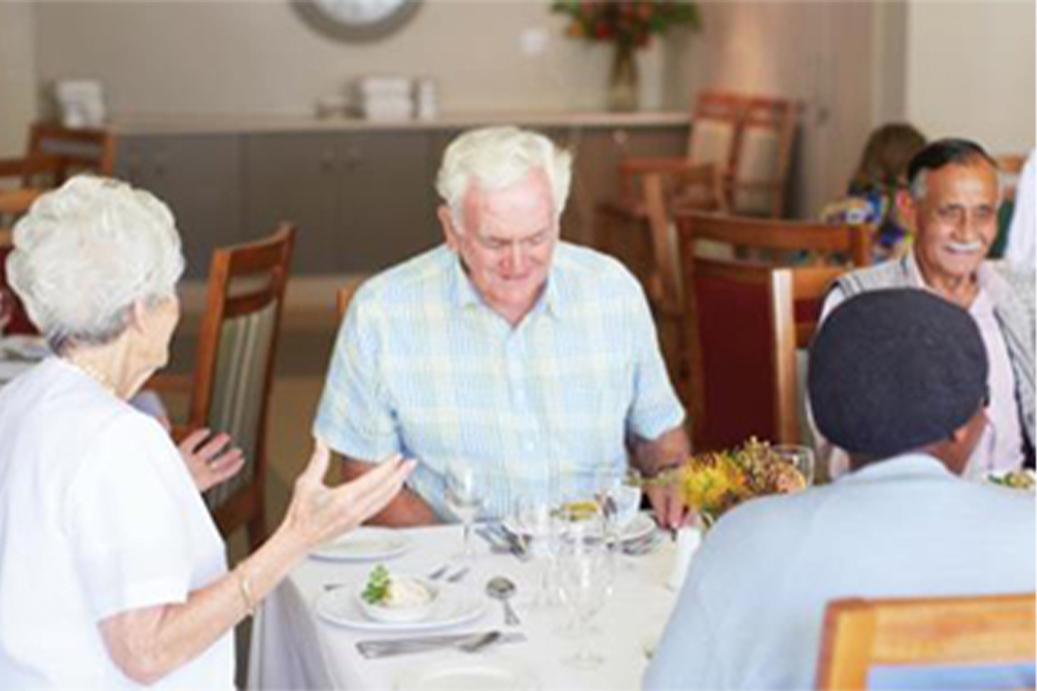Residents enjoy time together while dining