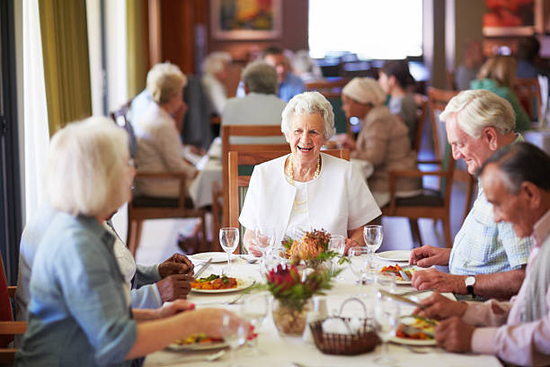 A group of residents sharing a meal together