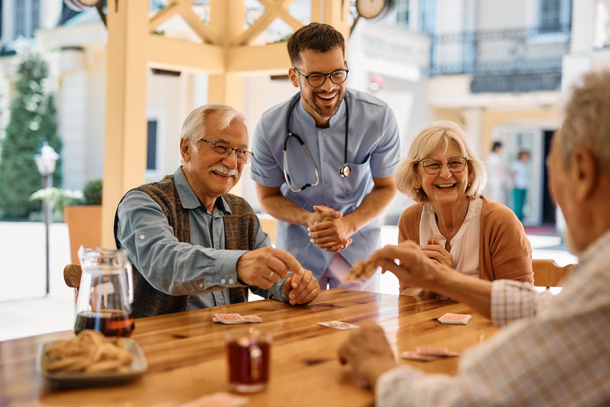 Residents enjoy playing a game of cards