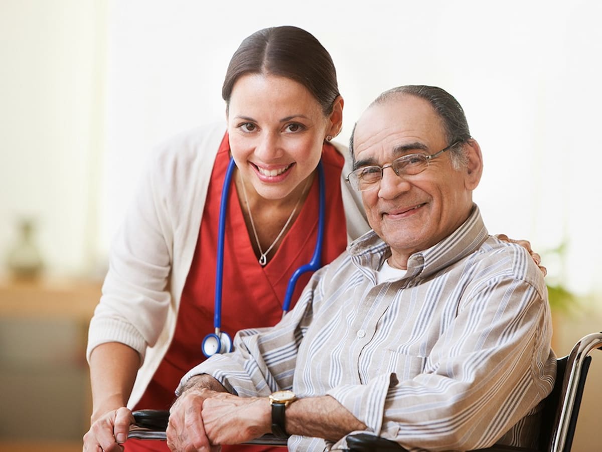 A nurse enjoys spending time with a resident