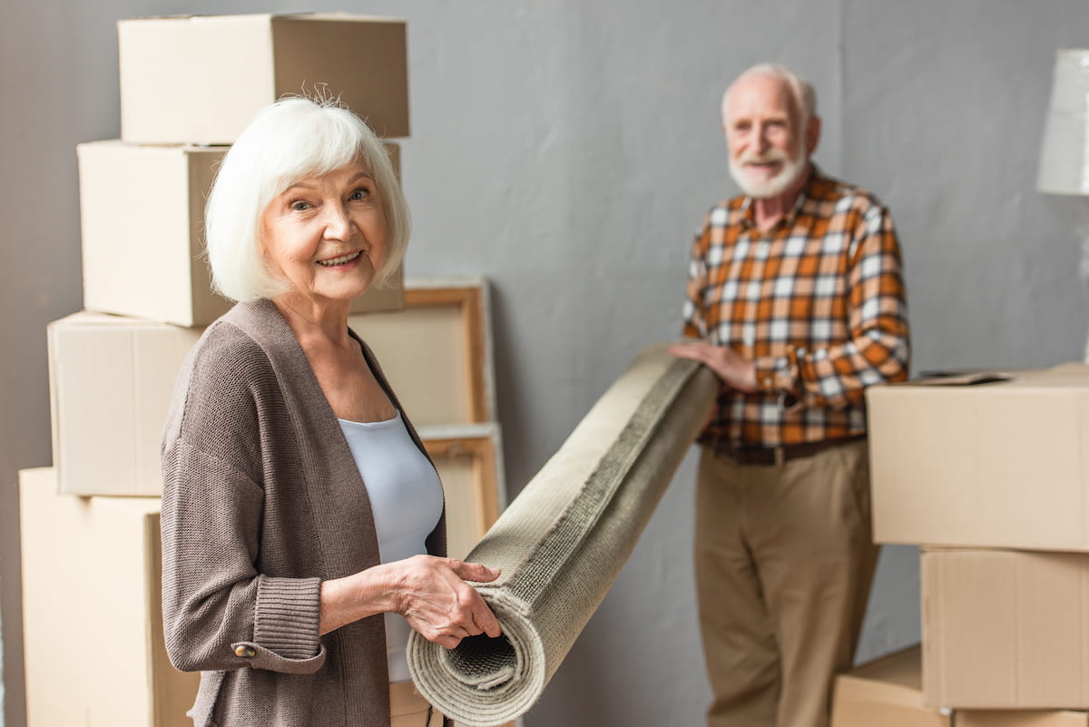 A couple moving into their independent living apartment