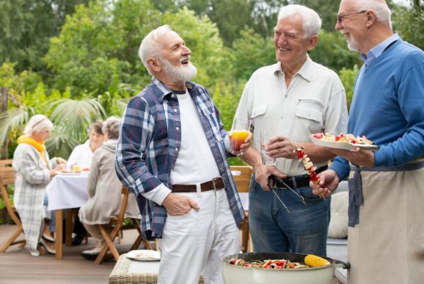Senior adults enjoy making skewers on the grill