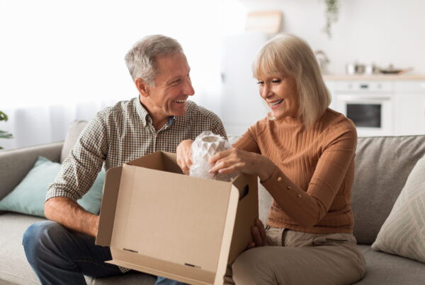 Elderly couple unboxing their belongings