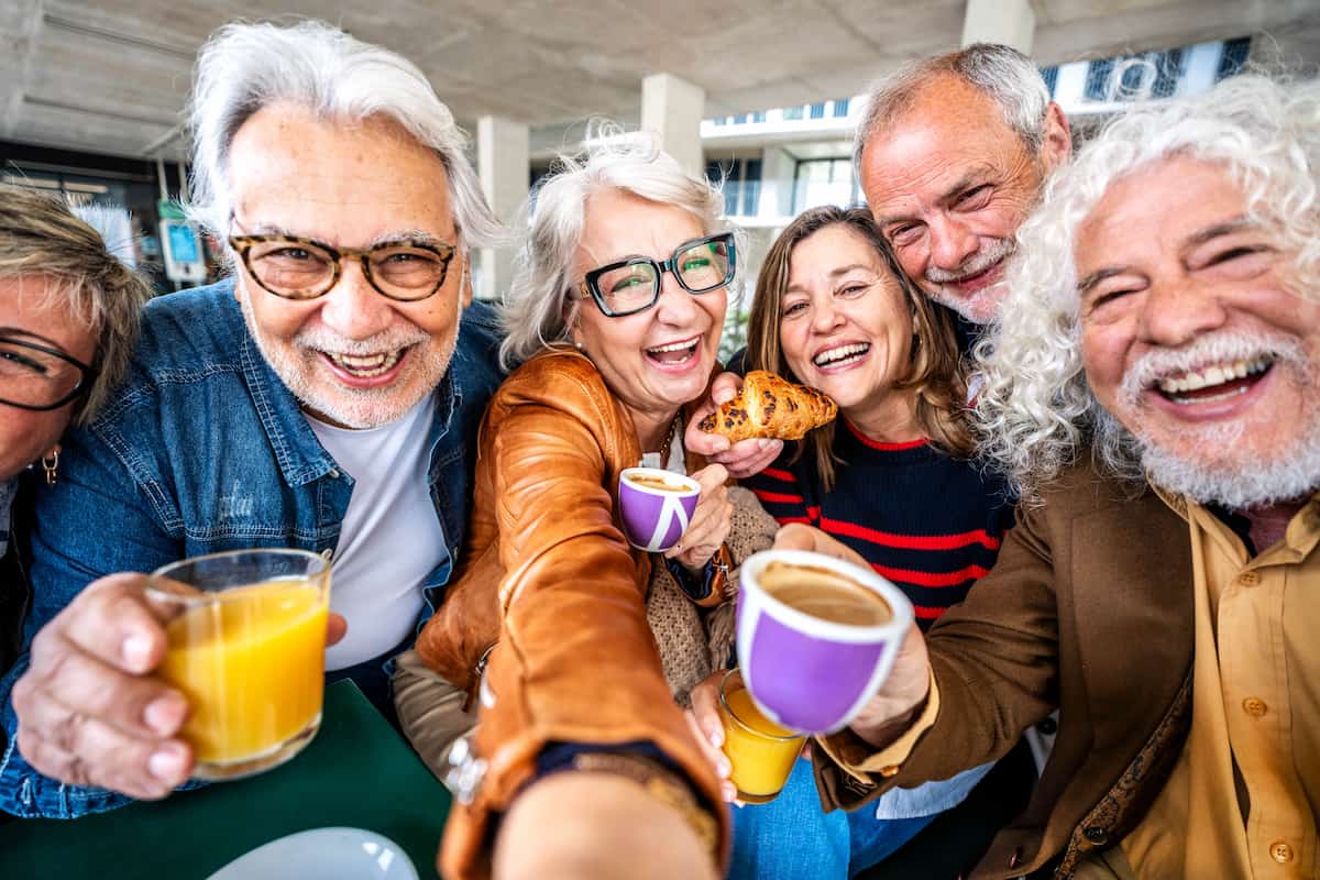A group of senior adults enjoying snacks and drinks together