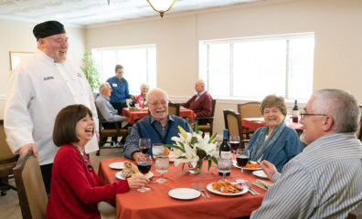 chef with seniors at table
